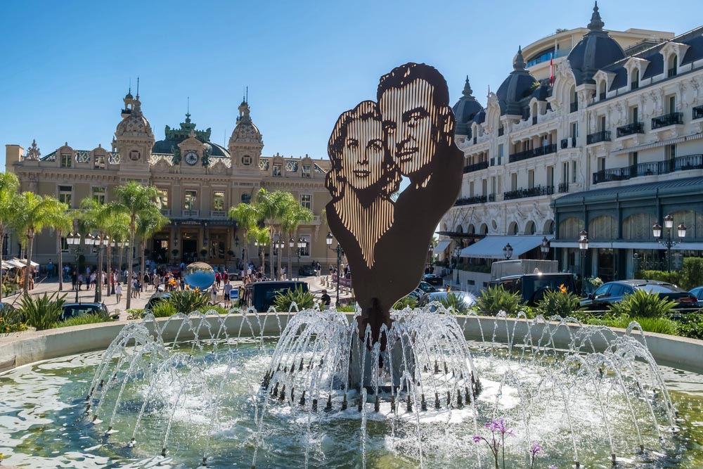 Monaco - September 29, 2024: Garden of the Small Africa or Jardins de la Petite Afrique featuring a central fountain with a sculpture of Princess Grace Kelly and Prince Rainier